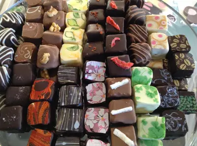 a bunch of different types of chocolate on a plate at Penzion Čokolaterie in Třebenice