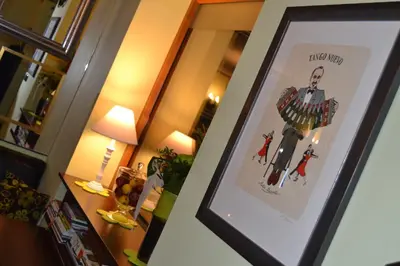 a framed picture of a man on a wall at Penzion Čokolaterie in Třebenice
