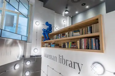 a library with a book shelf with books at MeetMe23 in Prague