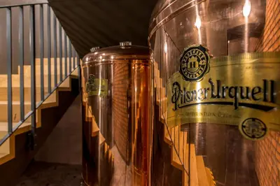 a large metal barrel sitting next to a staircase at MeetMe23 in Prague