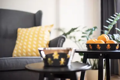 a living room with two tables with oranges on them at Hanan's Benedikt in Prague