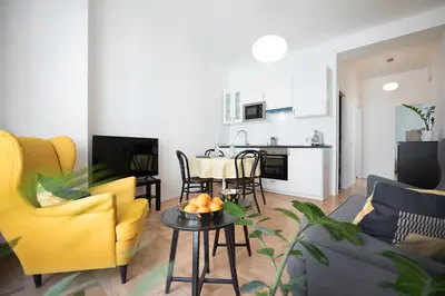a living room with a couch and a table at Hanan's Benedikt in Prague