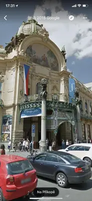 a building with a car parked in front of it at Hanan's Benedikt in Prague