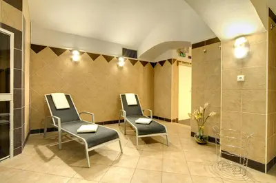 a waiting room with two chairs and aapsed at Theatrino Hotel in Prague