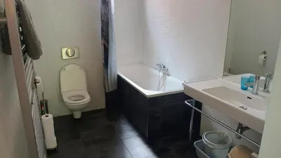 a bathroom with a toilet and a sink and a bath tub at Park View - a digital Nomad's dream in Prague