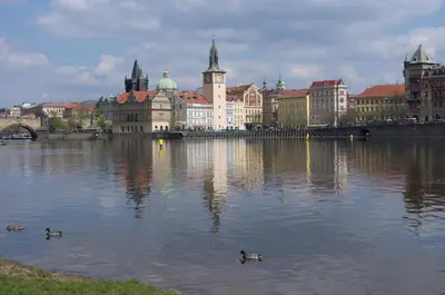 a city with ducks in the water with buildings at Park View - a digital Nomad's dream in Prague