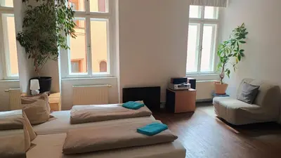 a living room with two beds and a couch at Park View - a digital Nomad's dream in Prague
