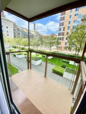 a kitchen with wooden cabinets and white counter tops at Apartment Korunni Dvur 130m2, 2 Free Parkings in Prague
