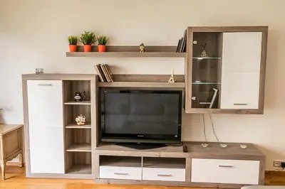 a living room with a couch and a mirror at Apartment Korunni Dvur 130m2, 2 Free Parkings in Prague