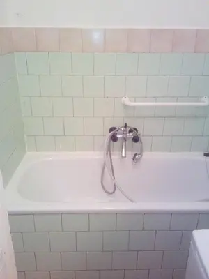 a bath tub with a faucet in a bathroom at flat 18 minutes from Vaclavske namesti in Prague