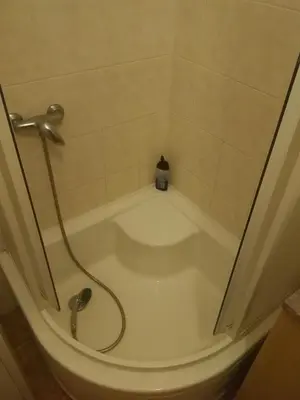 a bath tub with a shower in a bathroom at flat 18 minutes from Vaclavske namesti in Prague