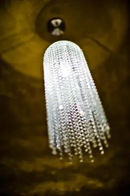 a silver chandelier hanging from a ceiling at Design Hotel Jewel Prague in Prague