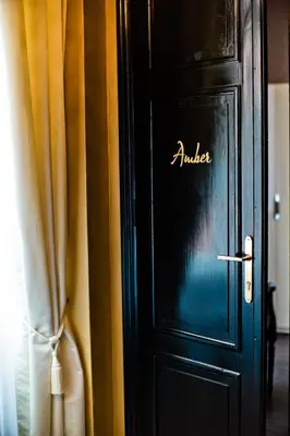a black door with the word murder written on it at Design Hotel Jewel Prague in Prague