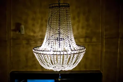 a chandelier hanging from a ceiling in a room at Design Hotel Jewel Prague in Prague