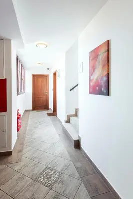 a living room with a couch and a coffee table at Family Apartments Praha 6 in Prague