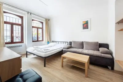 a bathroom with a sink and a bath tub at Family Apartments Praha 6 in Prague