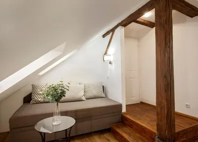 a living room with a couch and a table at Residence Corto Old Town in Prague