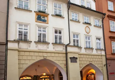 a building with a clock on the side of it at Residence Corto Old Town in Prague