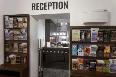 a book store with a sign that reads reception at Residence Corto Old Town in Prague