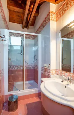a bathroom with a shower and a sink and a tub at Residence Jecna in Prague
