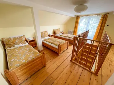 a living room with two beds and a balcony at Ubytování Kubantovi in Prague