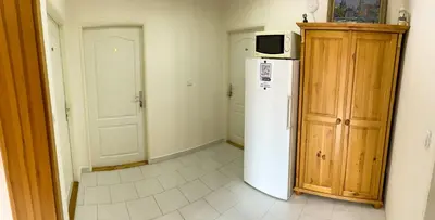 a kitchen with a white refrigerator and a microwave at Ubytování Kubantovi in Prague