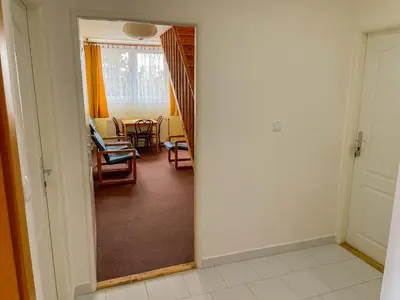 a hallway with a living room and a dining room at Ubytování Kubantovi in Prague