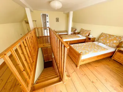 a room with two beds and a couch at Ubytování Kubantovi in Prague