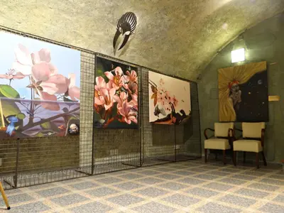 a waiting room with paintings on the walls at Hotel U Kříže in Prague