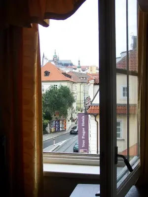 a view of a city street from a window at Hotel U Kříže in Prague