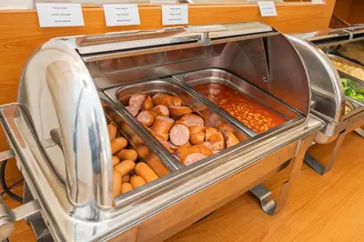 a display case of food in a bakery at City Centre in Prague