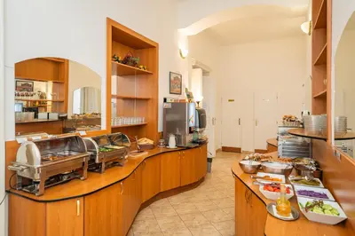 a kitchen with a counter with food on it at City Centre in Prague