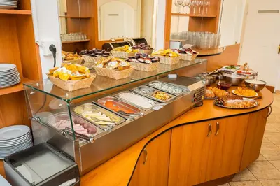 a buffet with many different types of food on it at City Centre in Prague