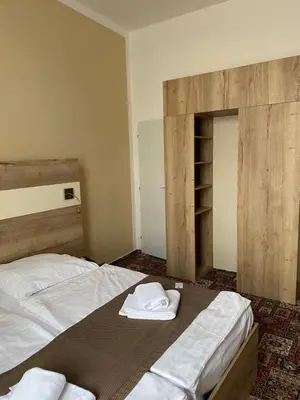 a bedroom with a bed with two towels on it at City Centre in Prague