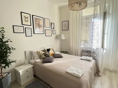 a bedroom with a bed with two pillows on it at Homelike Prague Apartment in Prague