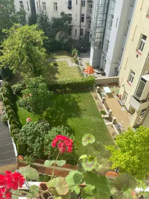 an aerial view of a garden with flowers and plants at Homelike Prague Apartment in Prague