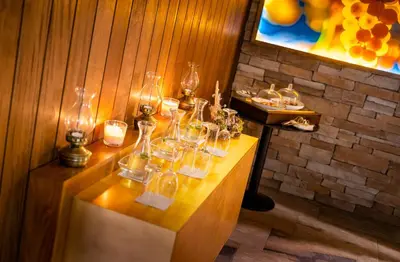 a bunch of wine glasses sitting on a table at Hotel Akademie in Chocerady