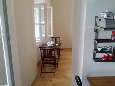a small table and chairs in a room with a window at Old Town Magical place in Prague