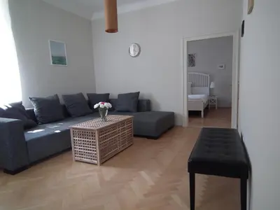 a living room with a couch and a table at Old Town Magical place in Prague