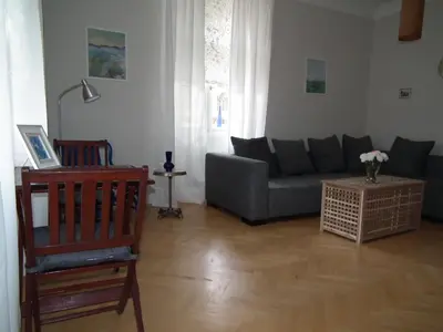 a living room with a couch and a table at Old Town Magical place in Prague