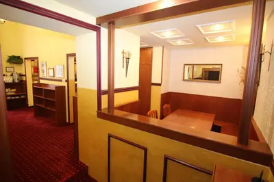 a conference room with a table and a mirror at Old Prague Hotel in Prague