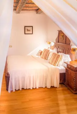 a bedroom with two beds and a wooden floor at The King Charles in Prague