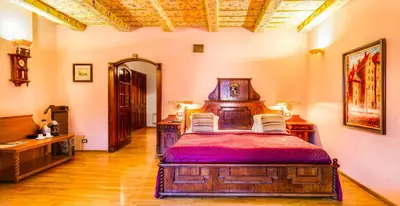 a bedroom with a wooden bed in a room at The King Charles in Prague