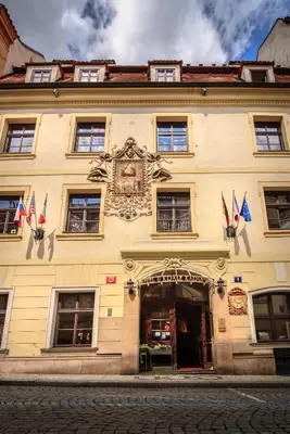 a building with flags on the front of it at The King Charles in Prague