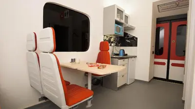 a kitchen with a table and a dining room at METRO Apartment Prague by Main Train and Bus Station in Prague