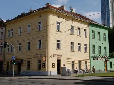 an old building on the corner of a street at Beta Pension in Prague