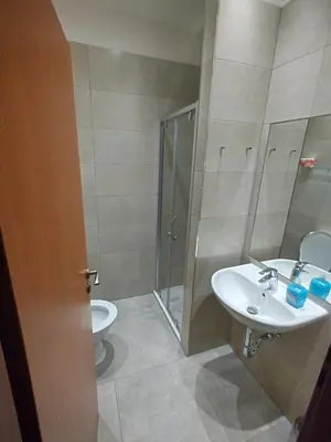 a bathroom with a sink and a shower and a toilet at Beta Pension in Prague