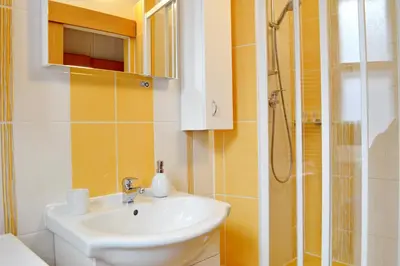 a bathroom with a sink and a shower at GE Apartments in Prague