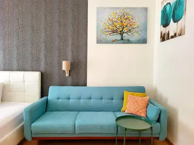 a living room with a couch and a table at GE Apartments in Prague