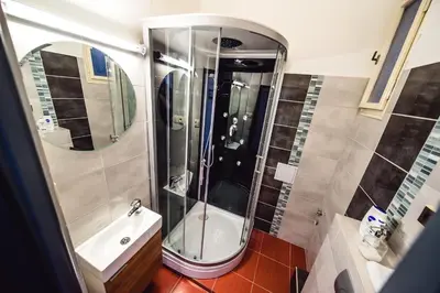 a bathroom with a shower and a sink at Michal&Michael’s Central Apartments in Prague